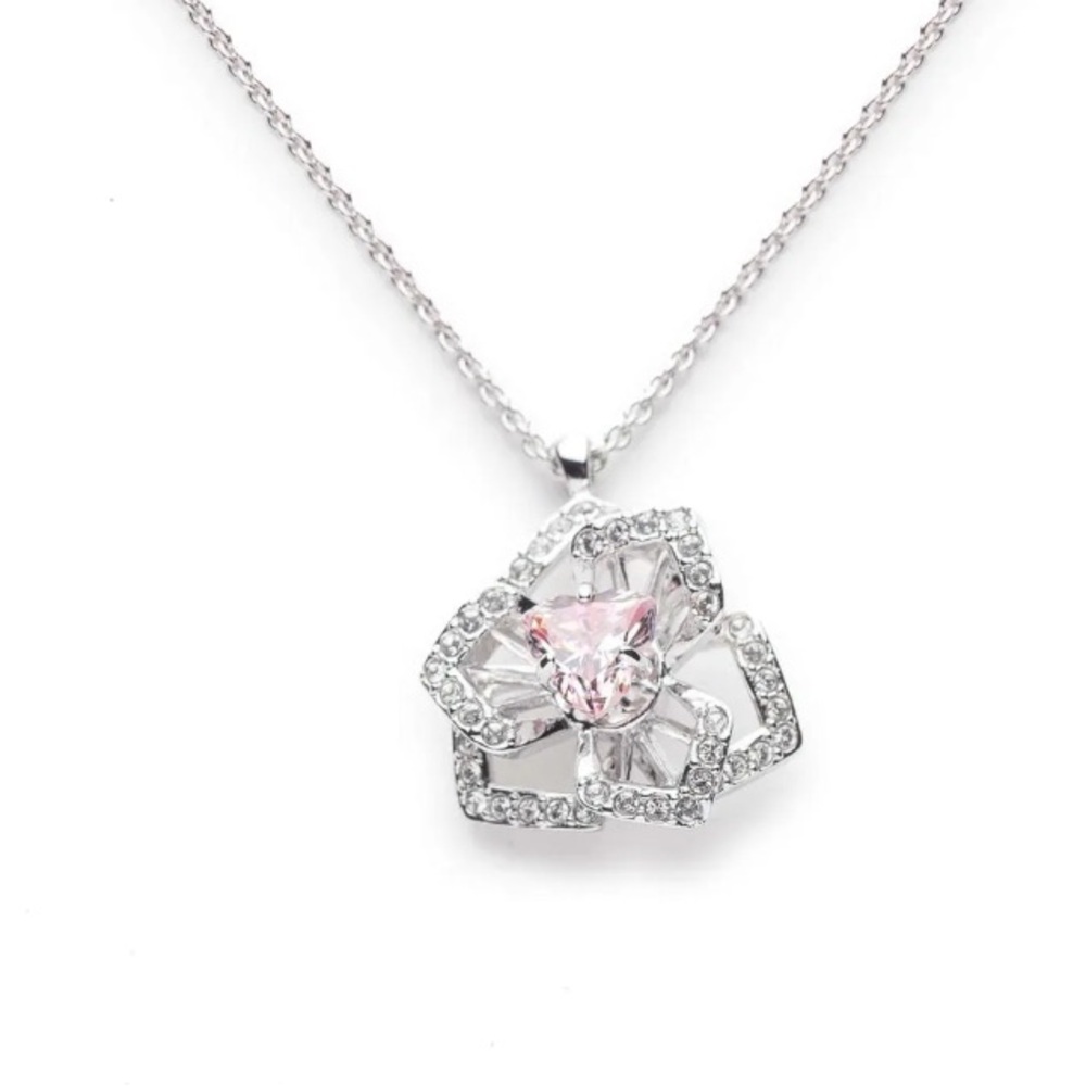 Swarovski spinning necklace with a pink stone NWT box included